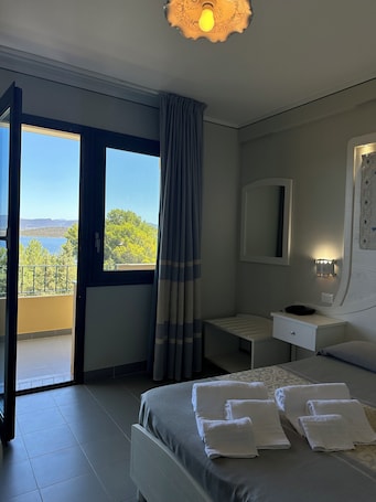Panoramic Double Room, Lagoon View | Minibar, in-room safe, individually furnished, blackout drapes. Hotel Cala dei Pini