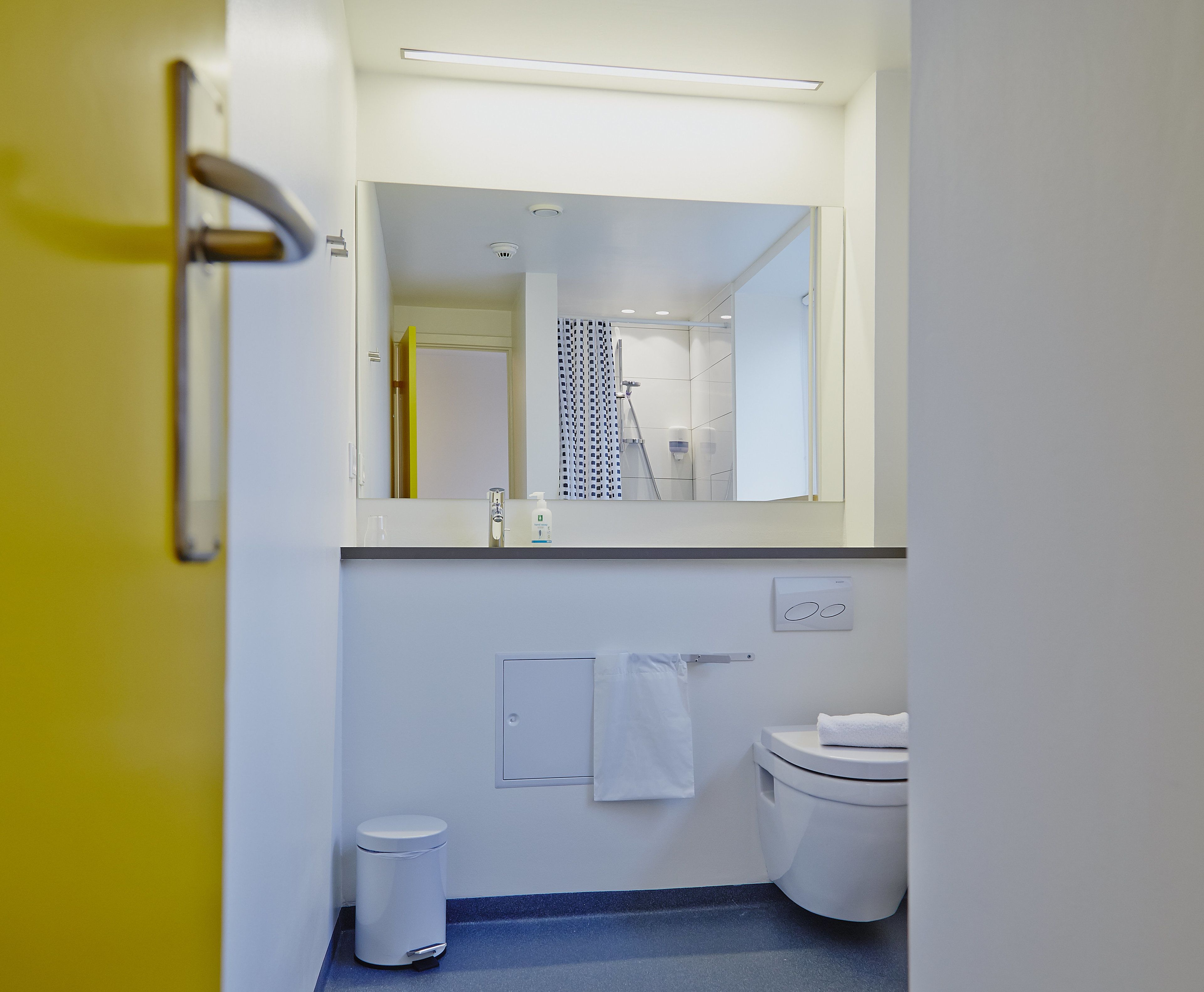 shower, hair dryer, towels, shampoo