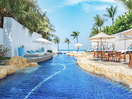 Outdoor pool, open 8:00 AM to 8:00 PM, pool umbrellas, sun loungers