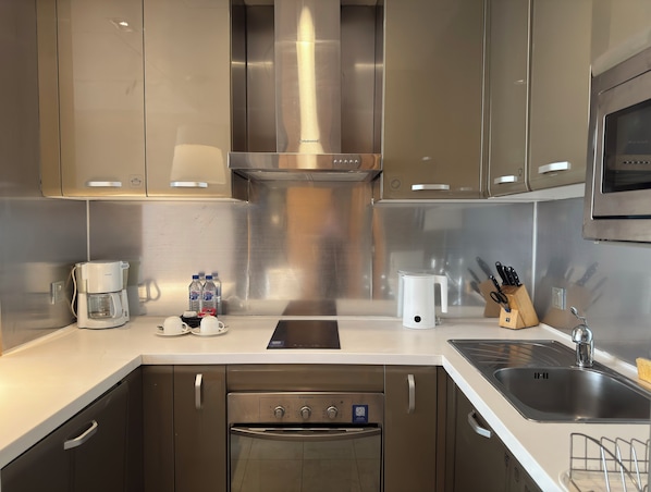 Executive Apartment, 1 Bedroom | Private kitchen | Fridge, microwave, stovetop, coffee/tea maker