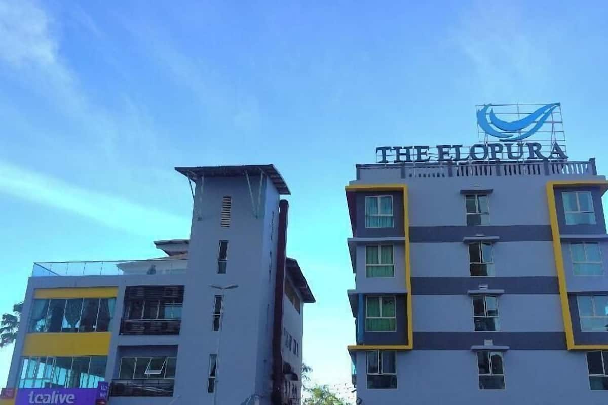 Two buildings with 'The Florura' sign on the right.