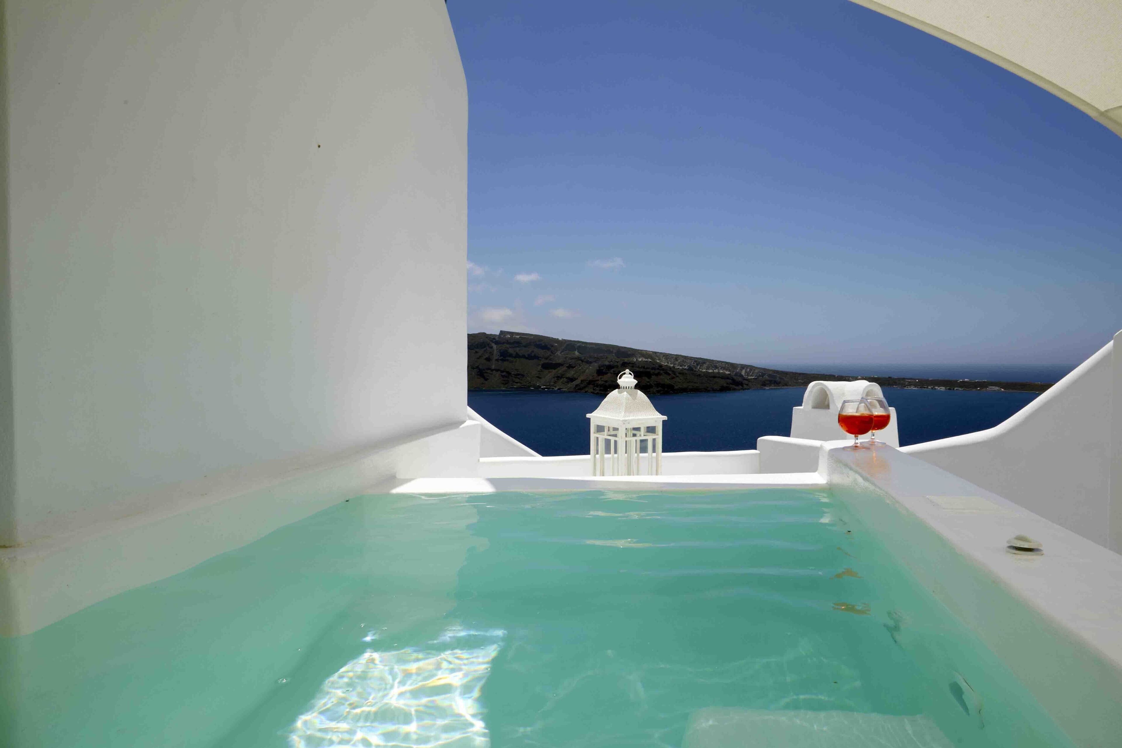 romantic room (cave, outdoor hot tub) | water view