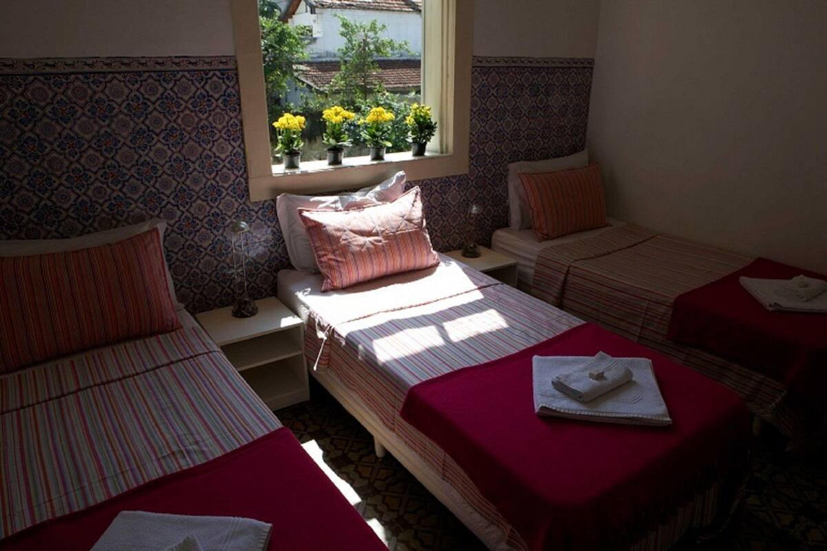 Deluxe Triple Room, Private Bathroom | Minibar, WiFi (free), bed sheets