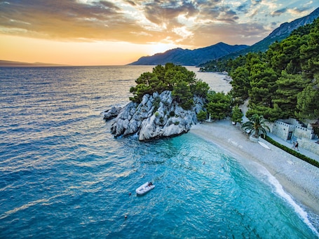 On the beach, sun loungers, beach umbrellas, scuba diving