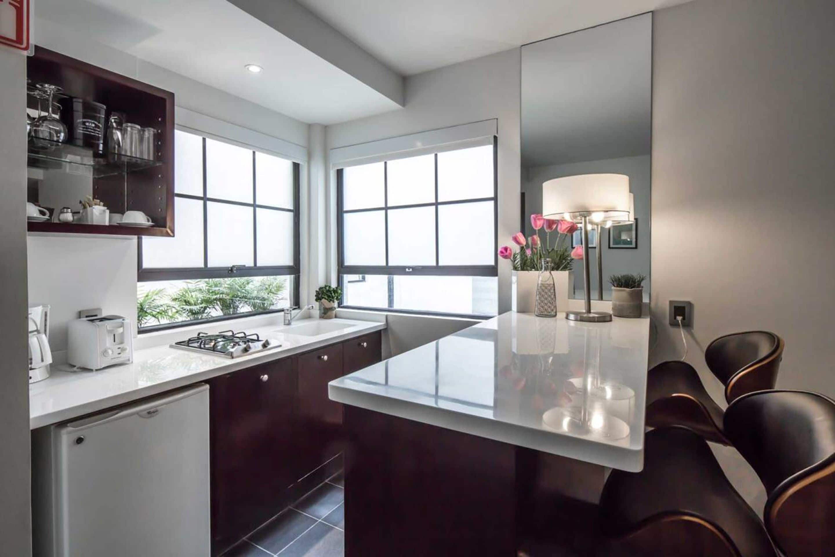 Fridge, microwave, stovetop, coffee/tea maker