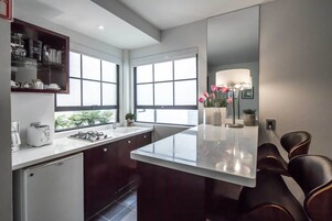 Fridge, microwave, stovetop, coffee/tea maker