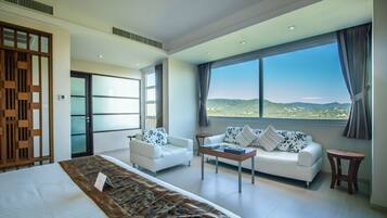 Deluxe Room, Garden View | Living area | 42-inch LCD TV with satellite channels, TV, fireplace