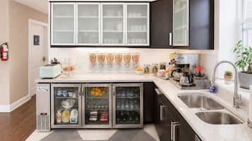 Full-size fridge, microwave, coffee/tea maker, cookware/dishes/utensils