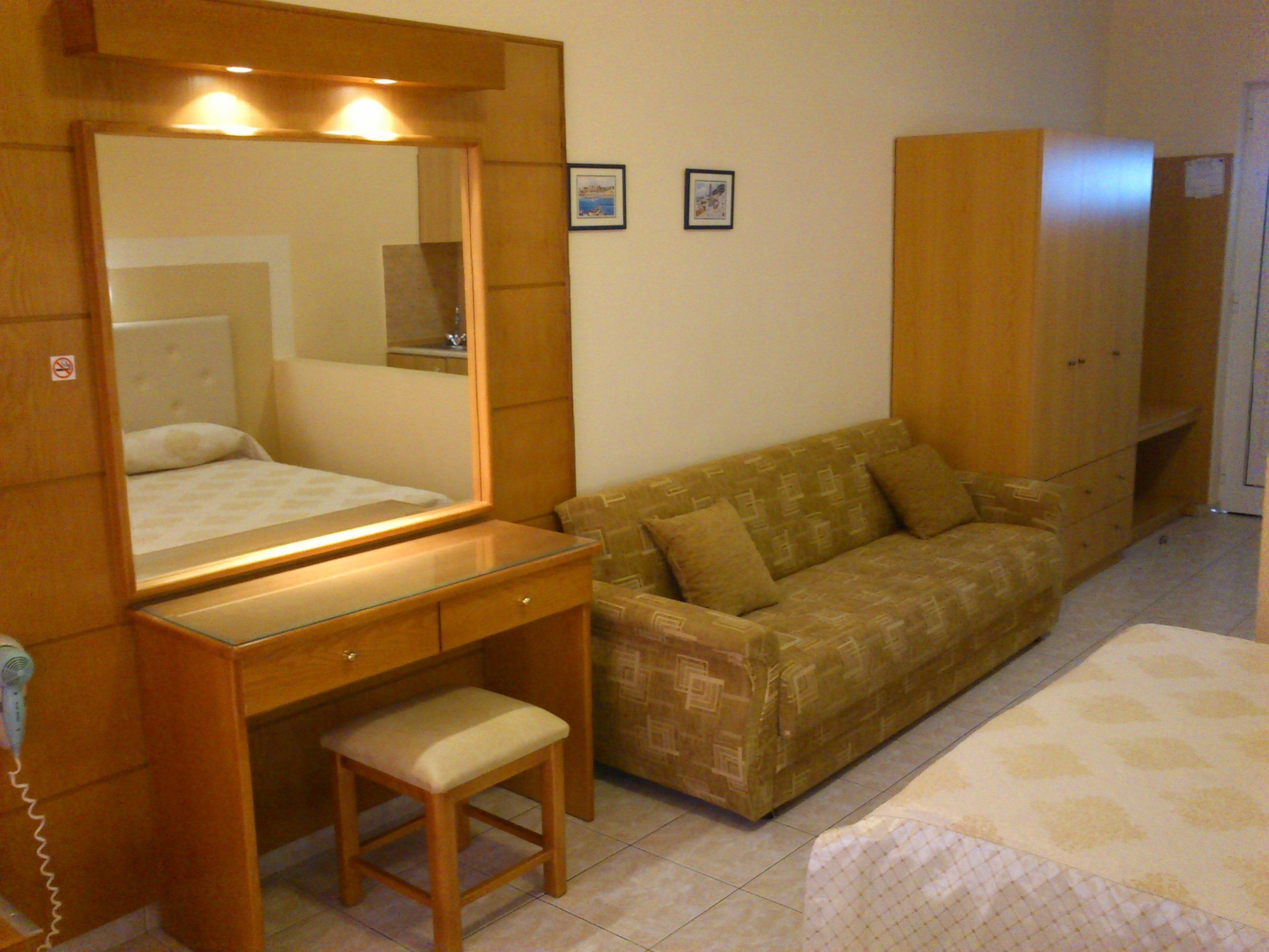 triple room | living area | flat-screen tv