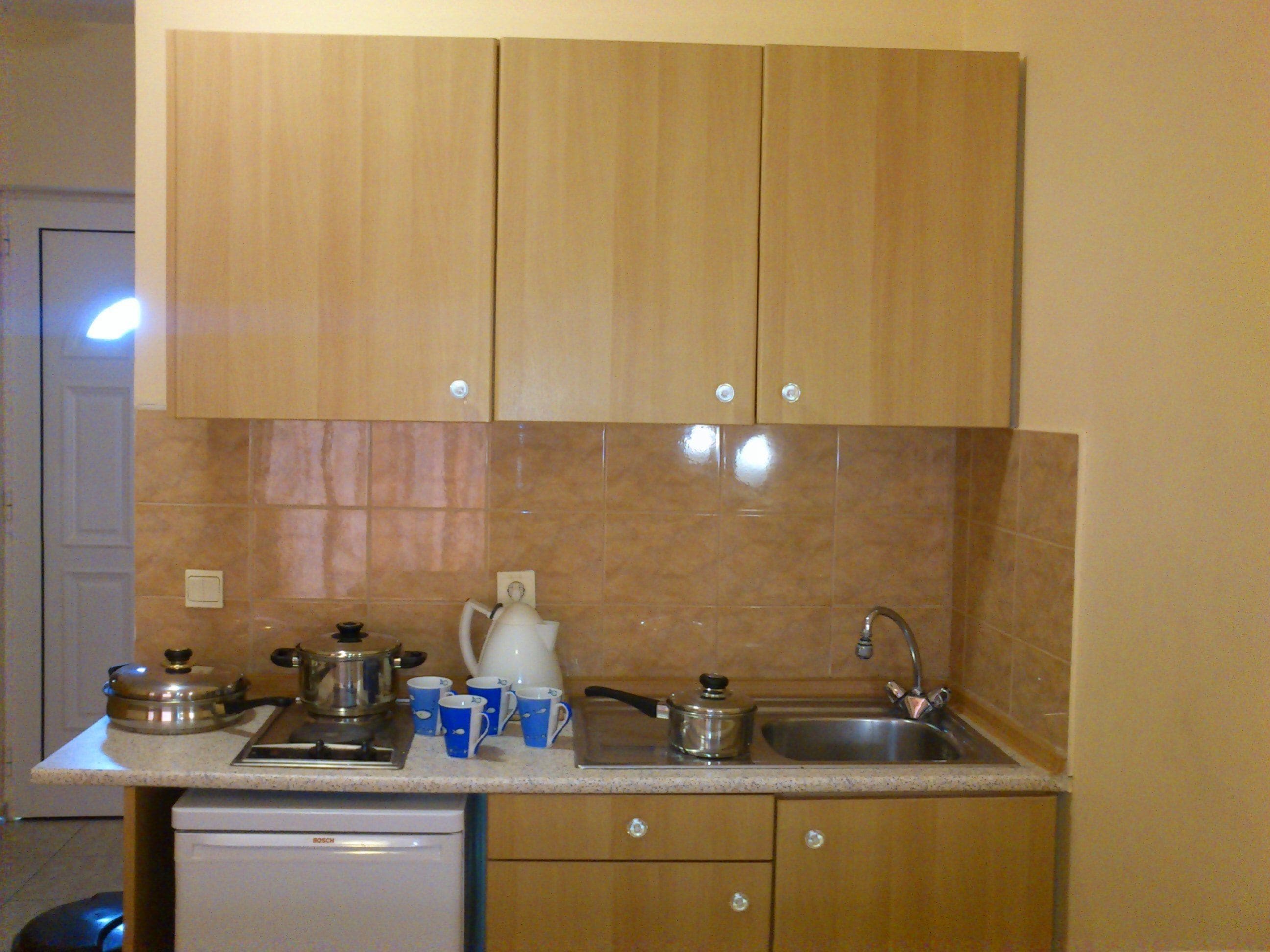 fridge, microwave, electric kettle, cookware/dishes/utensils