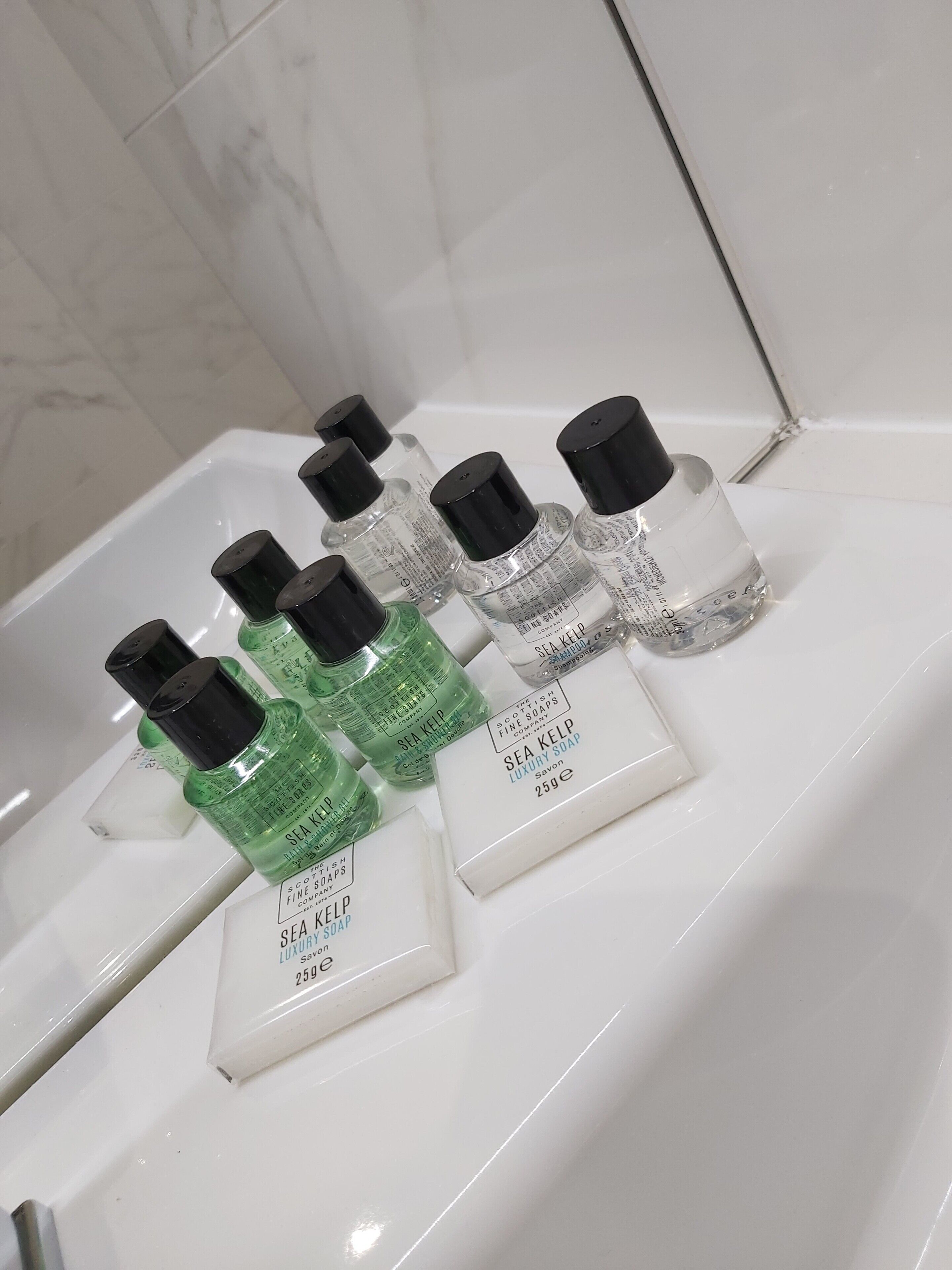 shower, designer toiletries, hair dryer, towels