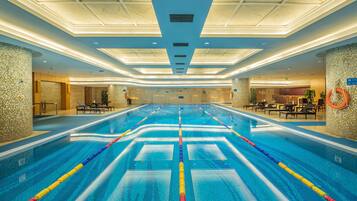 Indoor pool, open 6:30 AM to 11:30 PM, pool loungers, lifeguards on site