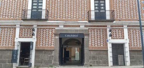 A building with a patterned facade and a sign reading "CASA PADUA". - Casa Padua (Puebla)