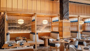 A traditional Japanese-style interior with tatami flooring, low tables, and cushions. - The Grand Dragon Ladakh (Leh)