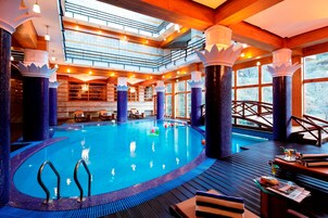 Indoor pool, open 9:00 AM to 6:00 PM, pool loungers