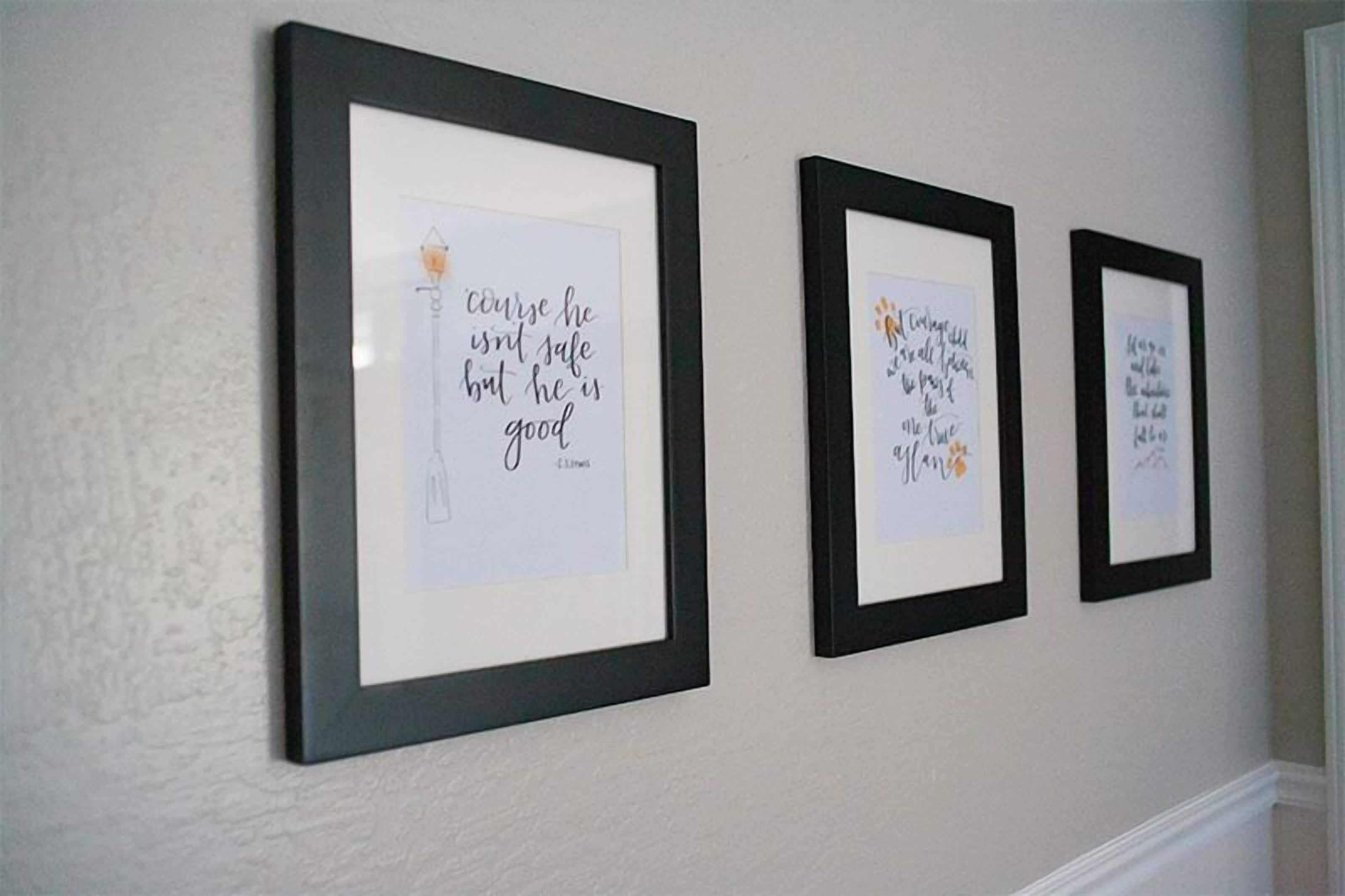 Three framed quotes on a wall.