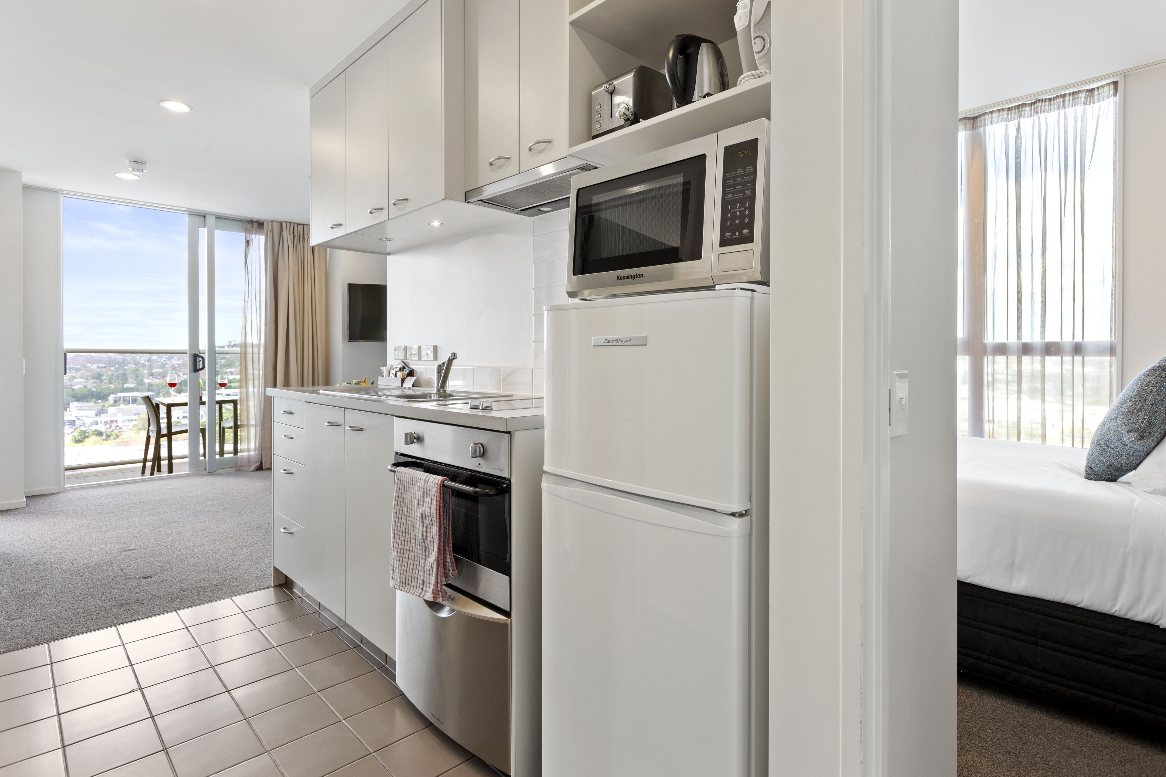 Deluxe Apartment, 2 Bedrooms, Balcony | Private kitchen | Fridge, microwave, oven, stovetop