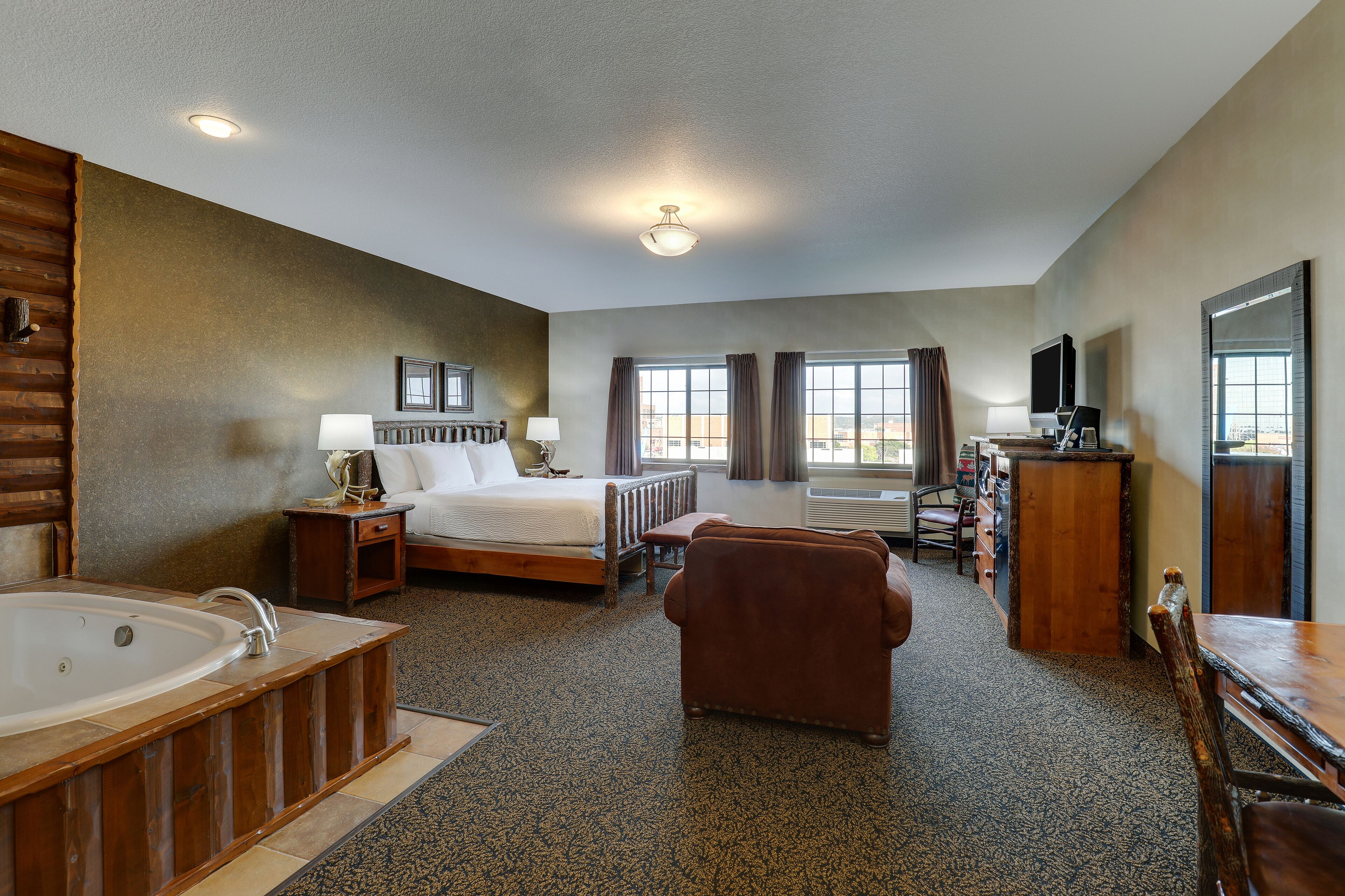 suite, 1 king bed, hot tub | 1 bedroom, premium bedding, desk, iron/ironing board
