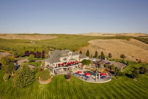 A large house with a patio, a swimming pool, and a well-maintained lawn. - Cameo Heights Mansion (Touchet)