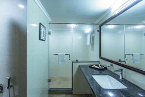 Suite | Bathroom | Free toiletries, hair dryer, slippers, towels - The Grand Regency (Rajkot)