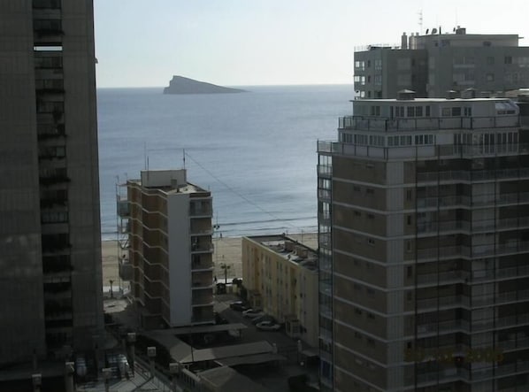 A coastal cityscape with high-rise buildings, a clear view of the sea, and a distant island. - Trebol One Apartments By Mc (Benidorm)