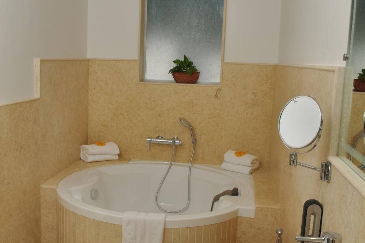 villa, 1 king bed | bathroom | rainfall showerhead, free toiletries, hair dryer, towels
