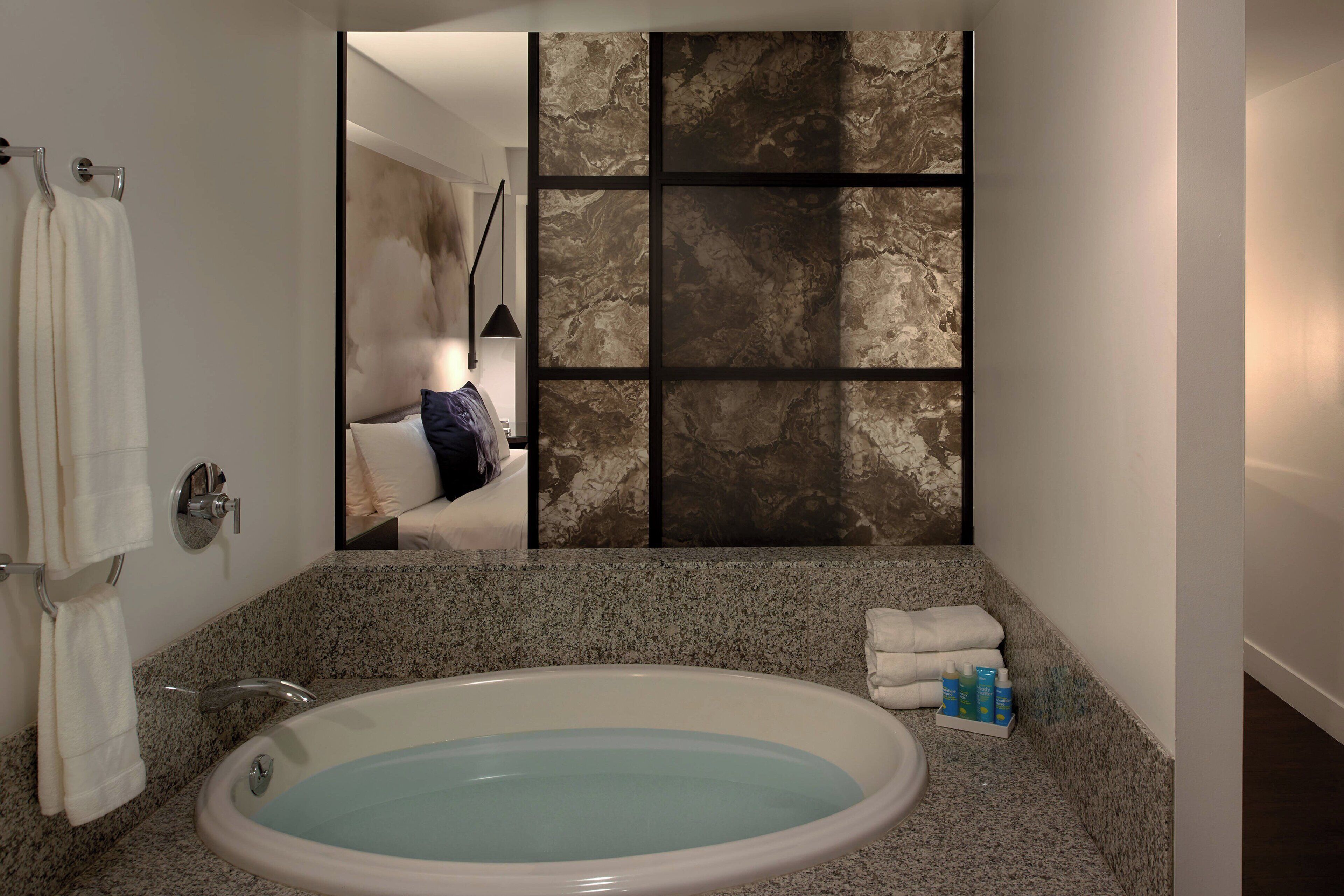 designer toiletries, hair dryer, bathrobes, towels