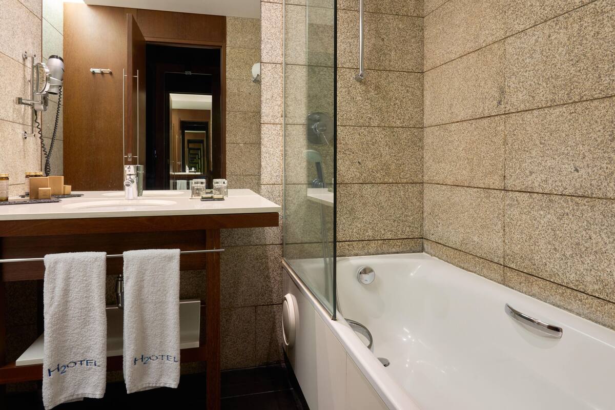 bathtub, free toiletries, hair dryer, bathrobes