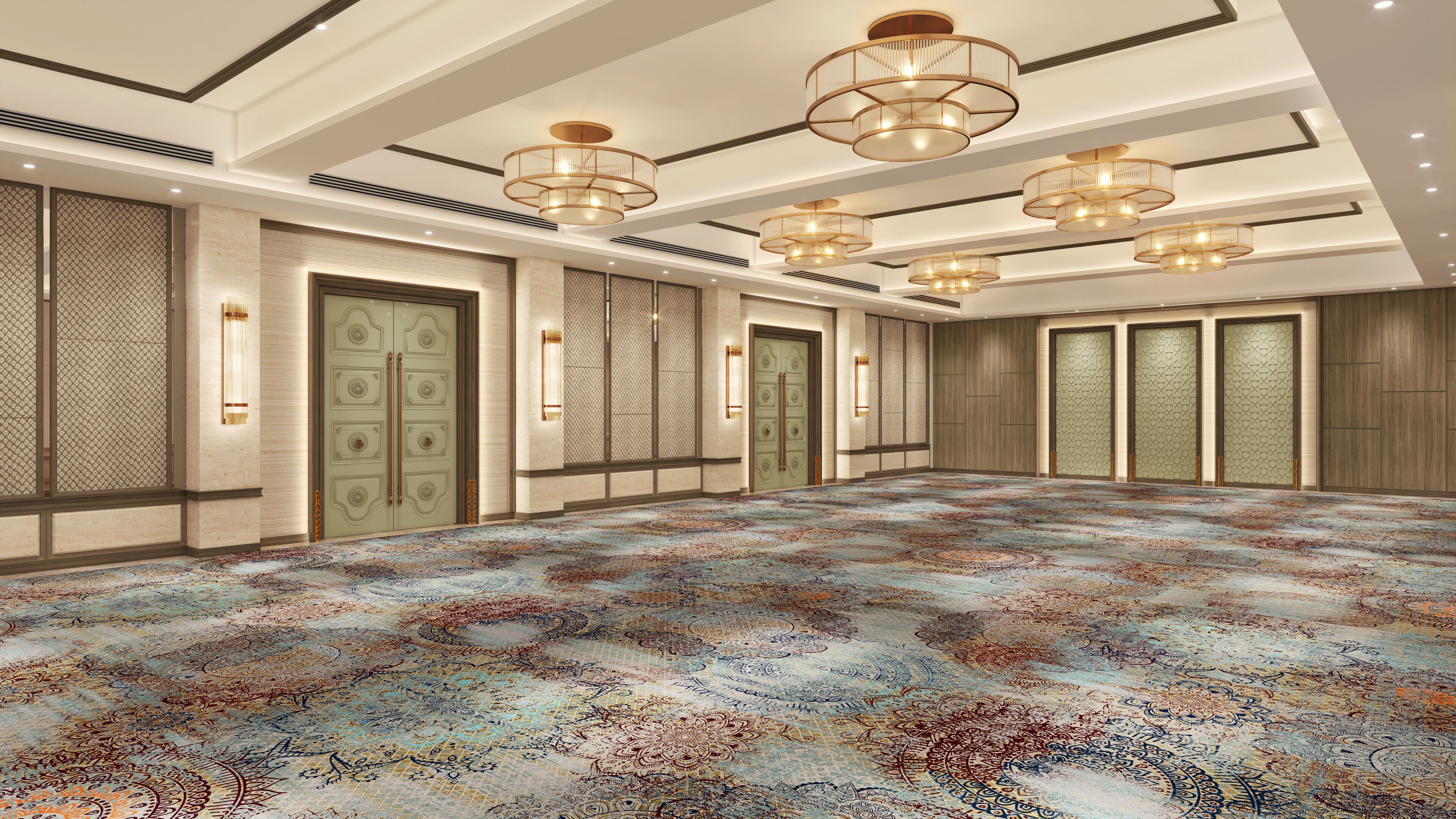 A spacious room with a patterned carpet, multiple doors, and a ceiling with hanging lights.