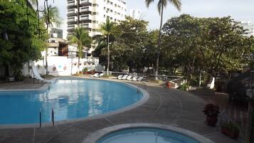 Outdoor pool, open 9 AM to 9 PM, pool loungers