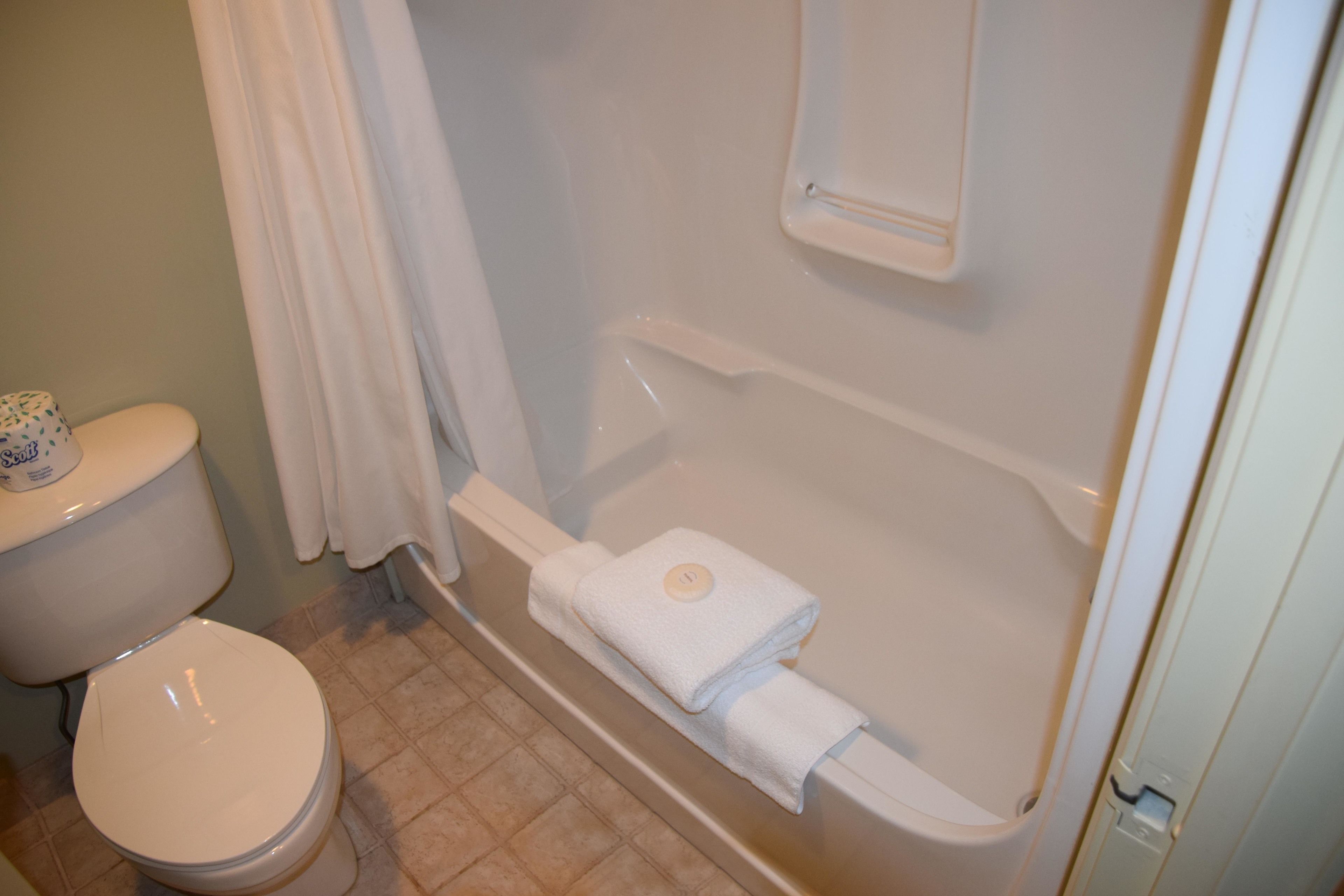 executive suite, 1 king bed with sofa bed | bathroom | free toiletries, hair dryer, bathrobes, towels