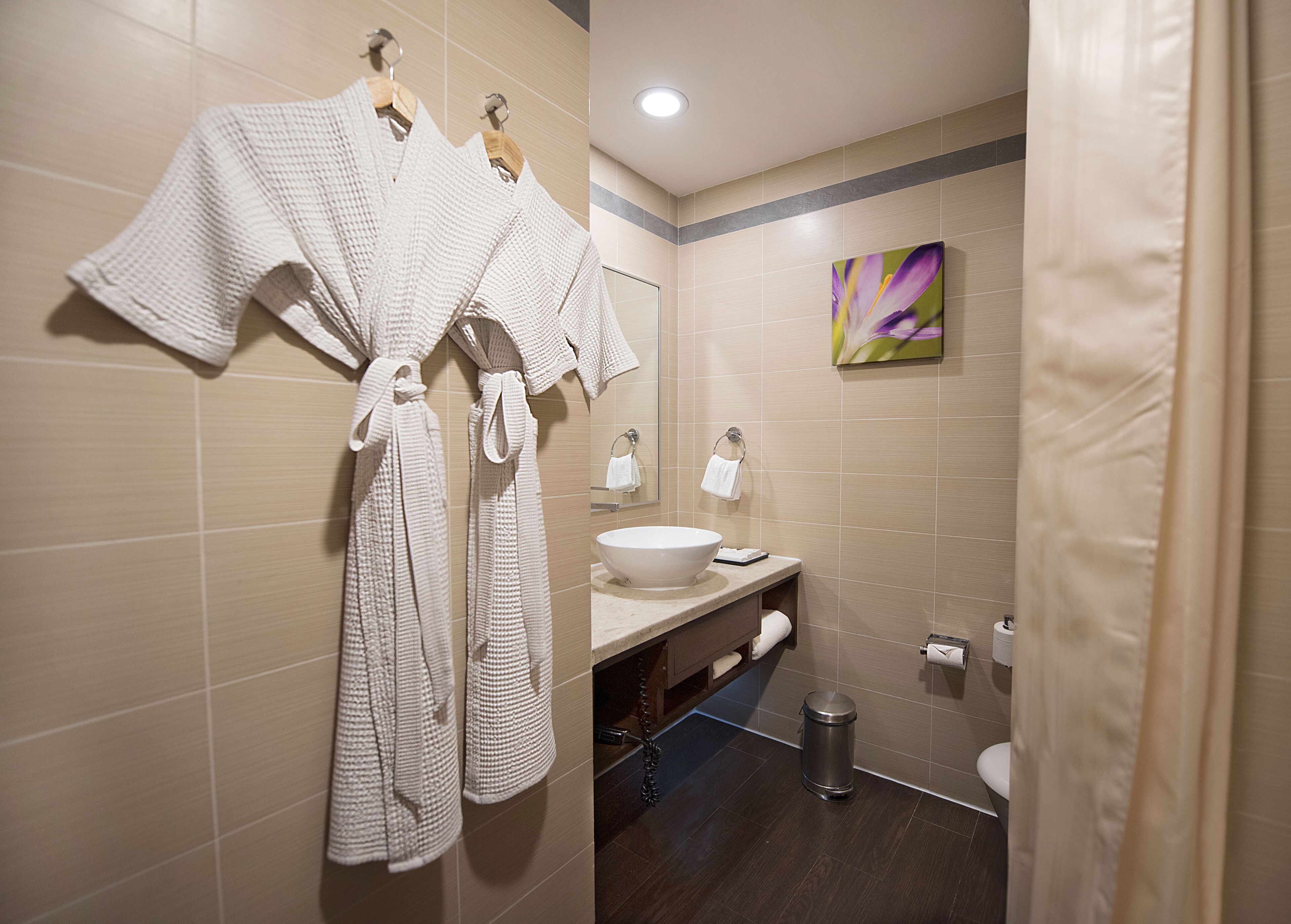 room, 1 king bed | bathroom | free toiletries, hair dryer, slippers, towels