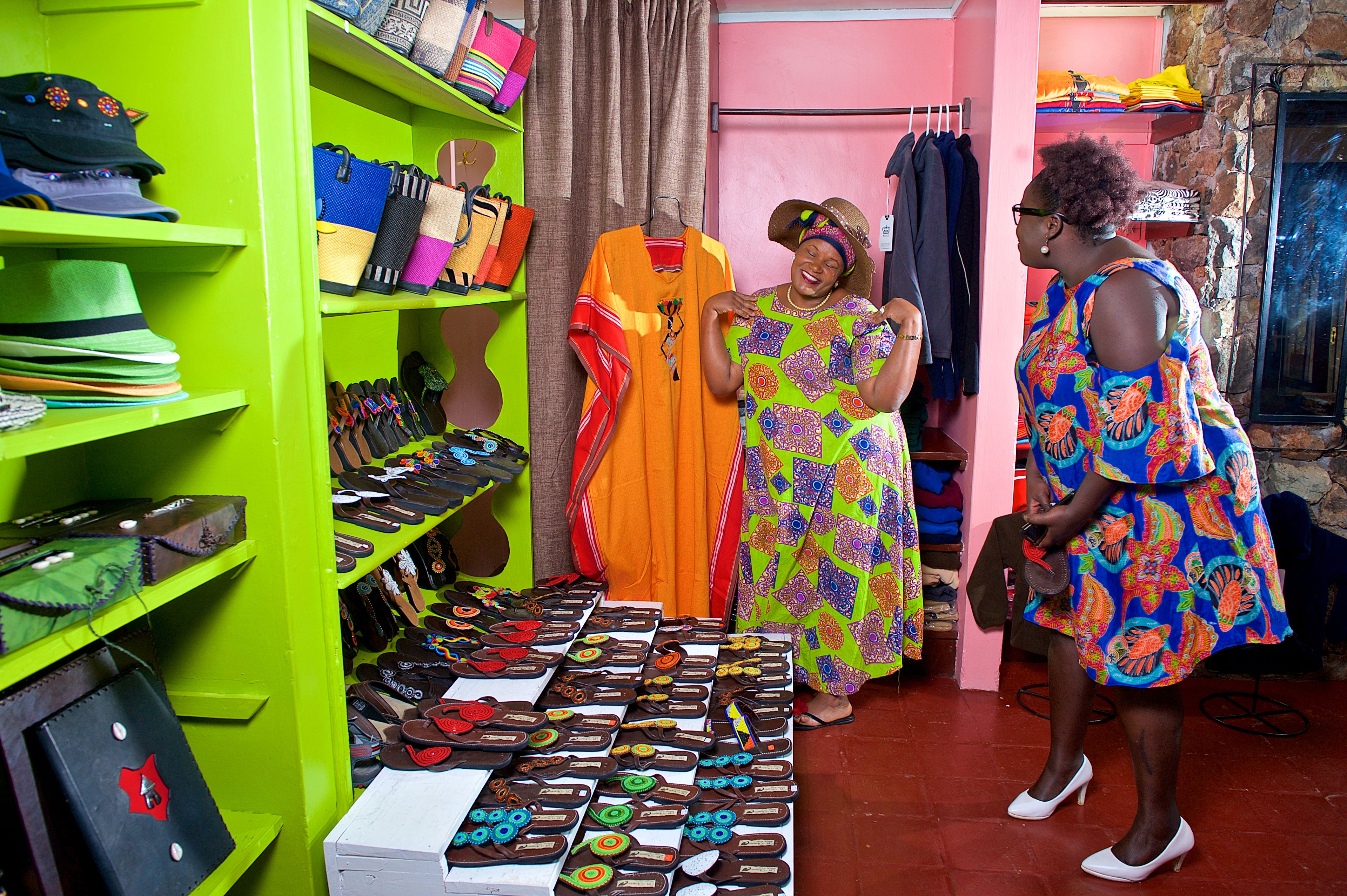 A boutique with shelves of hats, bags, and shoes.