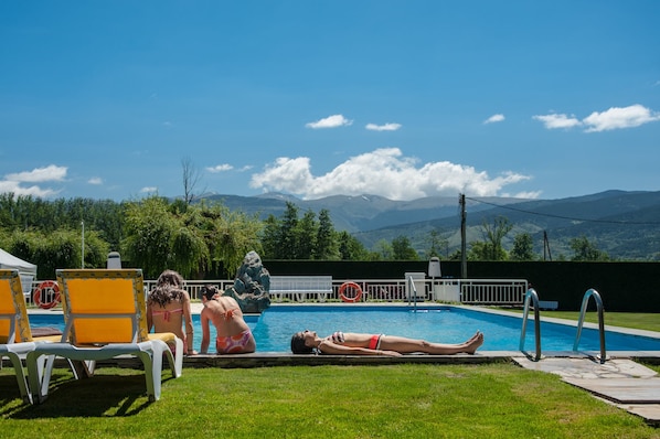 Seasonal outdoor pool, pool loungers