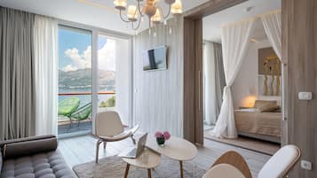 Junior Suite, Balcony, Sea View | Living area | TV