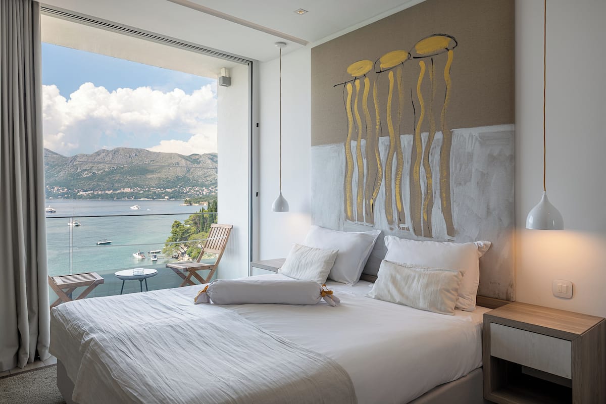 Deluxe Double Room, Balcony, Sea View | 1 bedroom, in-room safe, desk, blackout drapes