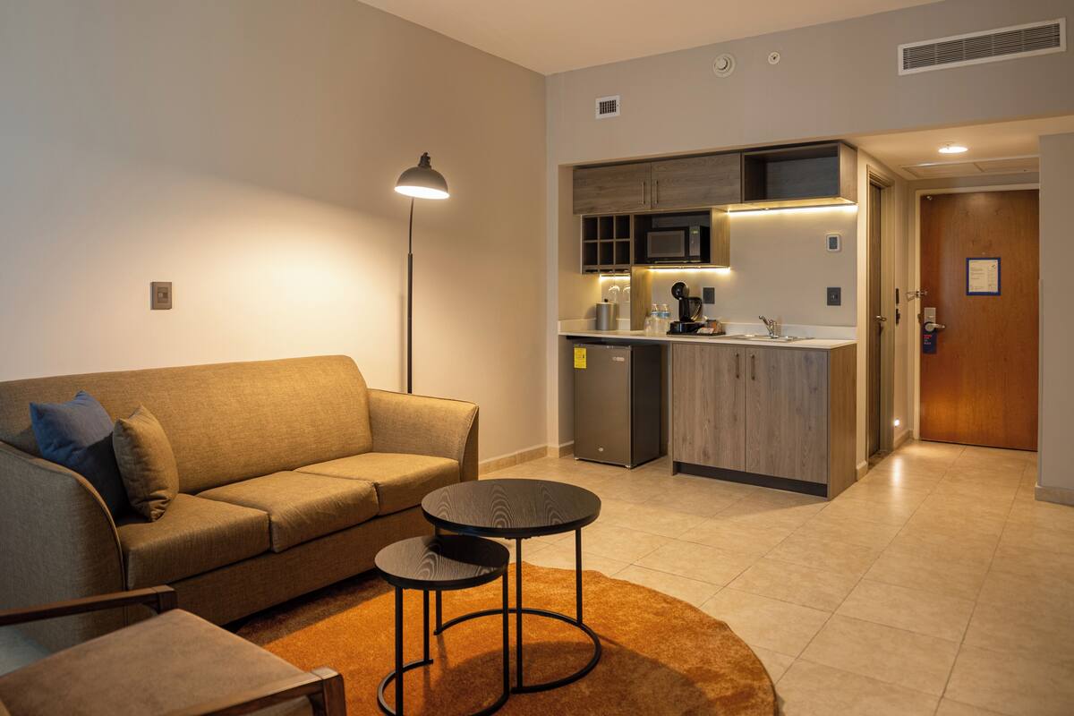 suite, 1 king bed, balcony | 1 bedroom, in-room safe, individually decorated, desk