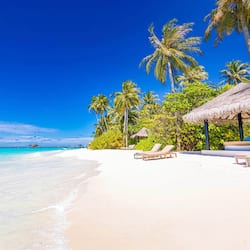 On the beach, white sand, beach towels, beach massages
