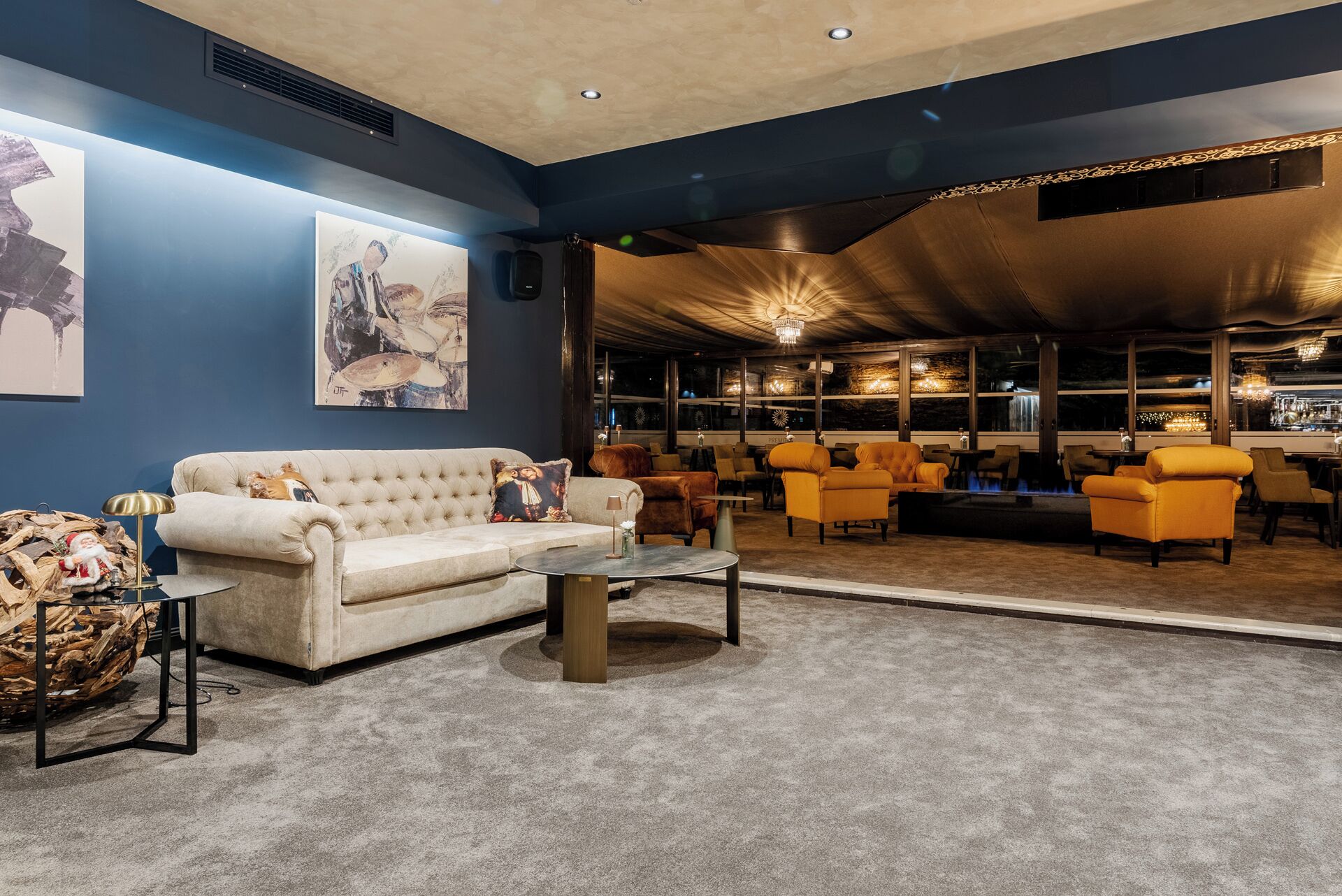 A lounge area with a sofa, armchairs, and a coffee table.