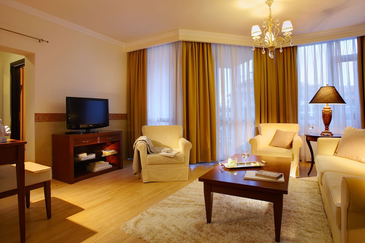 Deluxe Apartment, 2 Bedrooms | Minibar, in-room safe, individually decorated, individually furnished