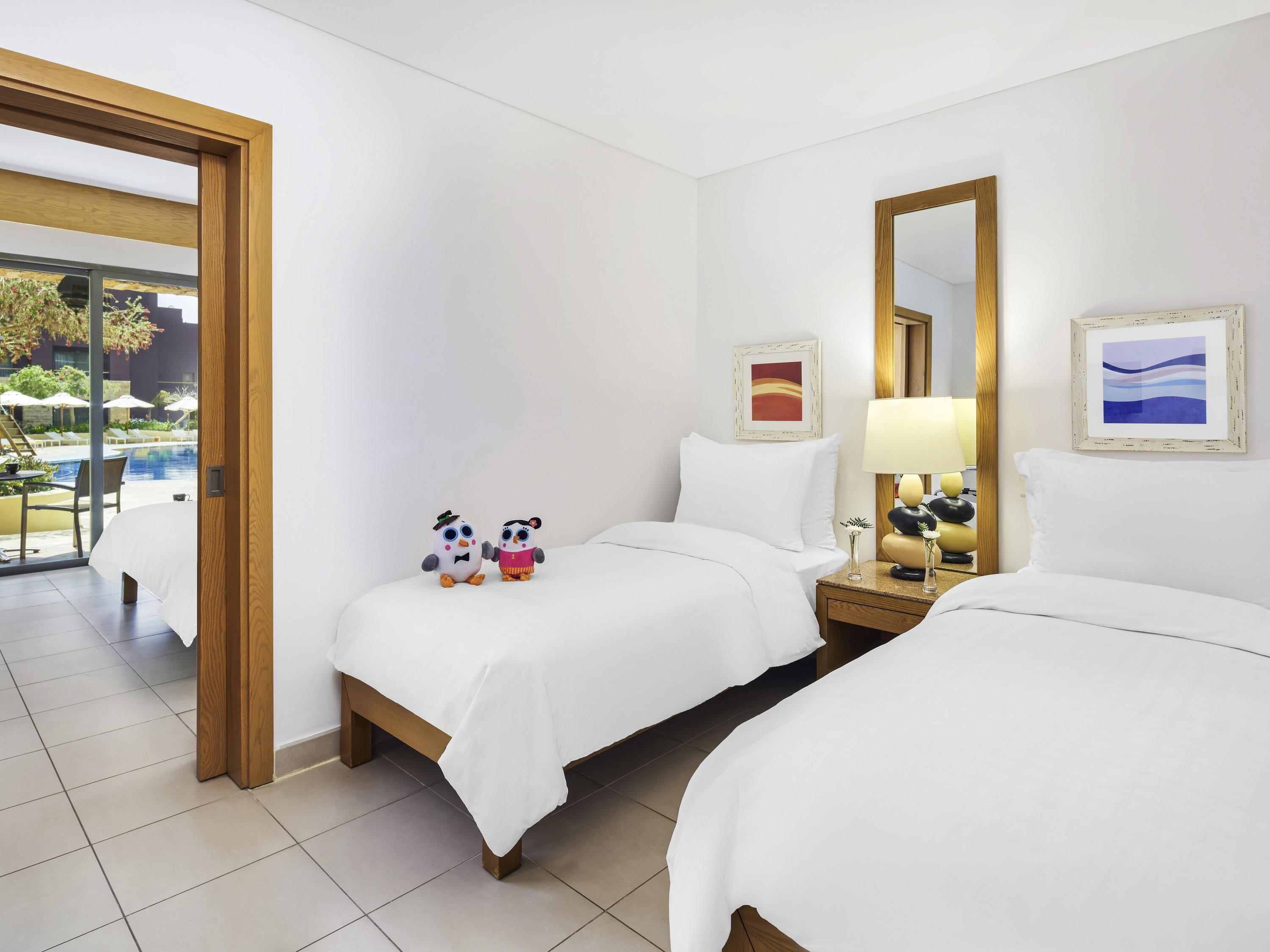 Family Room, 2 Double Beds, Pool View | Down duvets, pillow-top beds, free minibar items, in-room safe