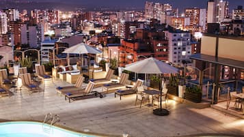 Outdoor pool, open 7:00 AM to 8:00 PM, pool umbrellas, pool loungers