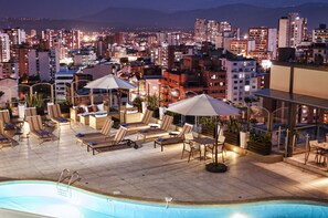 Outdoor pool, open 7:00 AM to 8:00 PM, pool umbrellas, pool loungers
