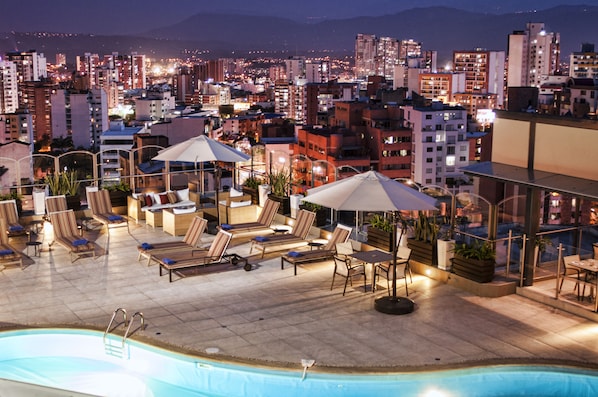 Outdoor pool, open 7:00 AM to 8:00 PM, pool umbrellas, pool loungers