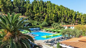 Outdoor pool, open 10:00 AM to 7 PM, pool umbrellas, pool loungers
