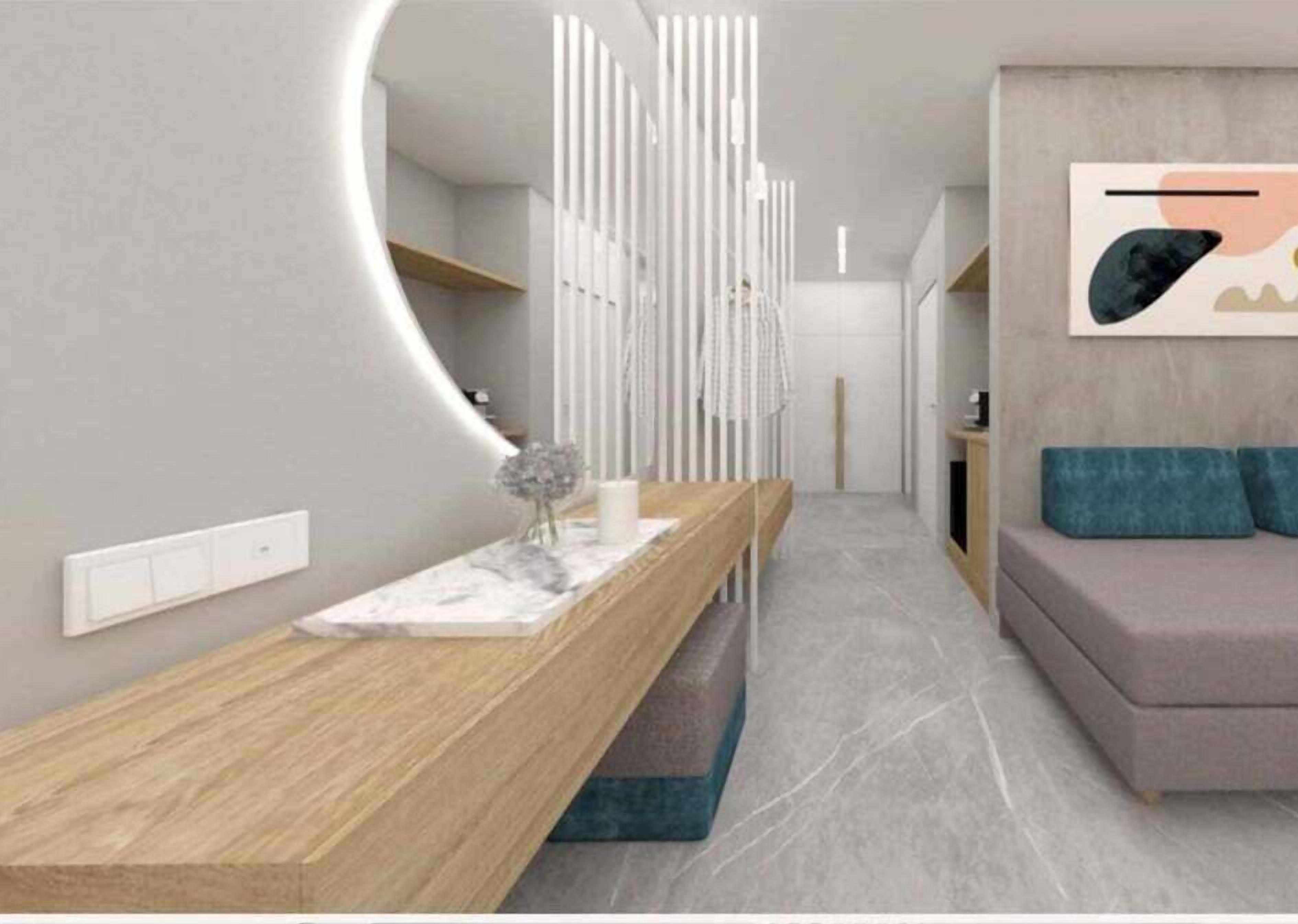 Un interno moderno con un tavolo consolle in legno, un divano grigio e un'opera d'arte appesa al muro.
