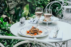 Dinner, brunch served; French cuisine, garden views