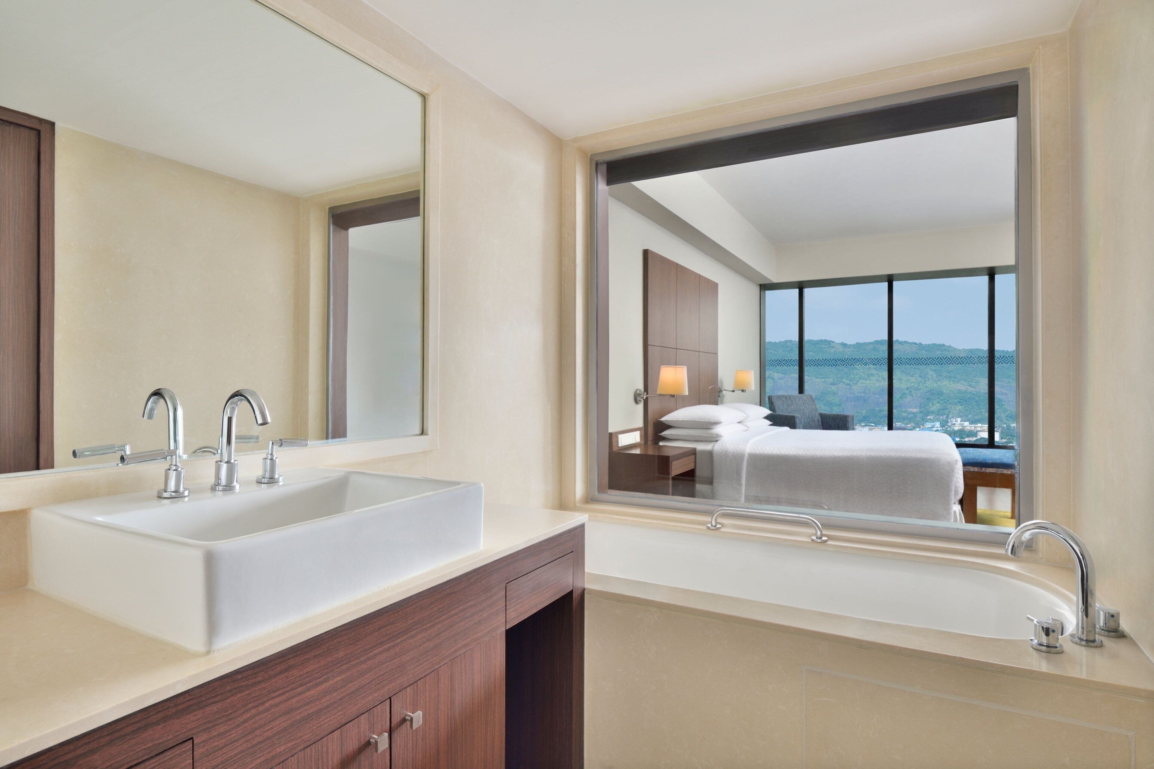 premier suite, 1 bedroom, pool view | bathroom | free toiletries, hair dryer, slippers, towels
