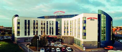 A modern hotel with a prominent sign reading "Vienna House."