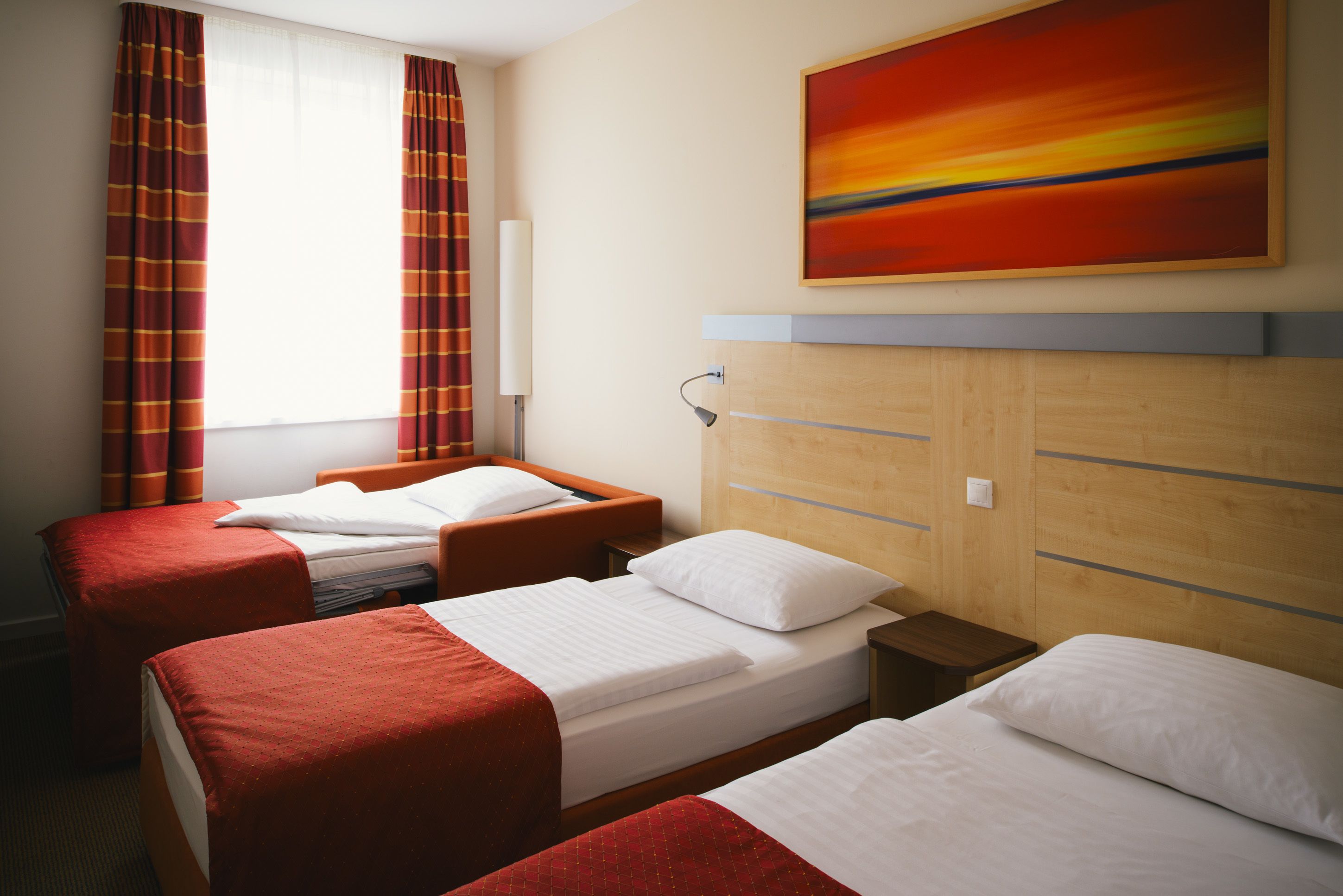 hypo-allergenic bedding, desk, laptop workspace, blackout curtains